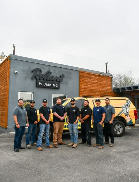 Fieldstone Westside crew posing in front of shop and work truck